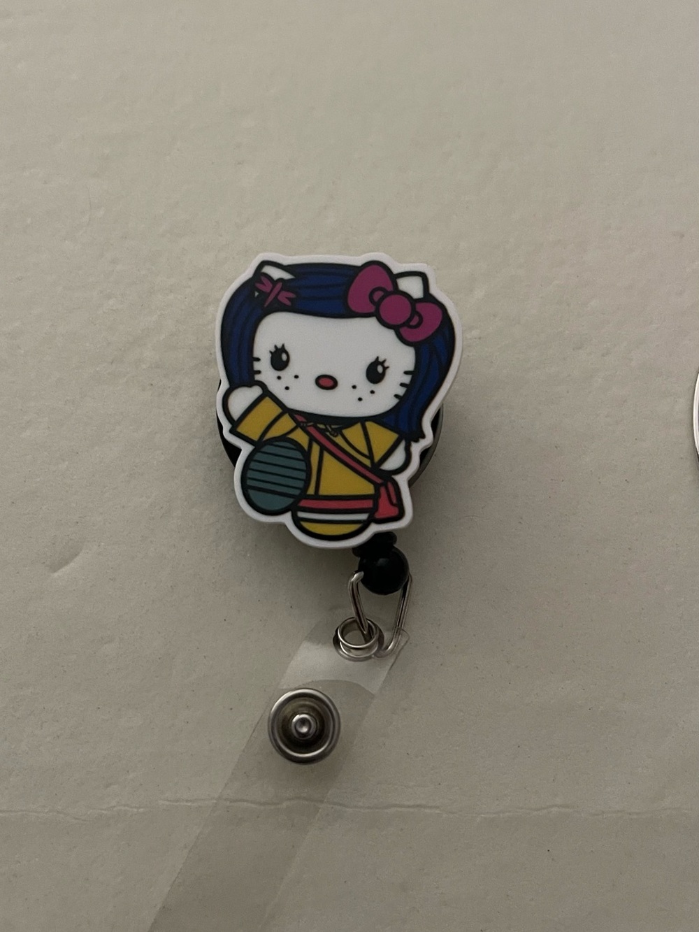 Hello Kitty Badge Reel with Pink Bow and Blue Hair